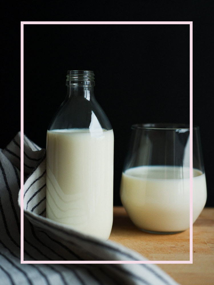 A bottle and a glass of milk